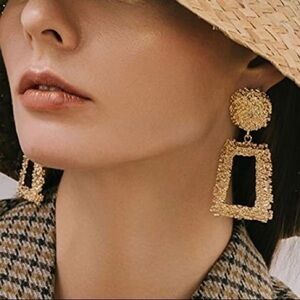 Gold toned dangle earrings